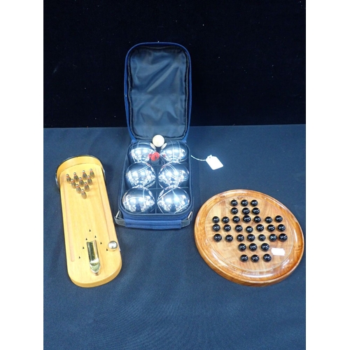 221 - A MINIATURE TEN PIN SKITTLE GAME a solitaire board with marbles, and a carpet boules set