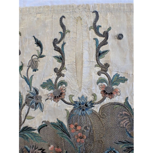 307 - AN 18TH CENTURY EMBROIDERED PANEL possibly fragment of bed hanging 104 x 47cms (damaged,couched onto... 