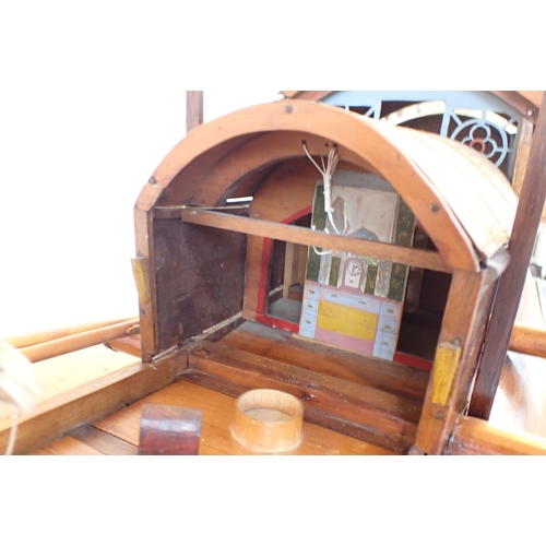 313 - AN EARLY 20TH CENTURY MODEL CHINESE JUNK with carved crew, purchased c.1920 by a Midshipman Tulloch,... 