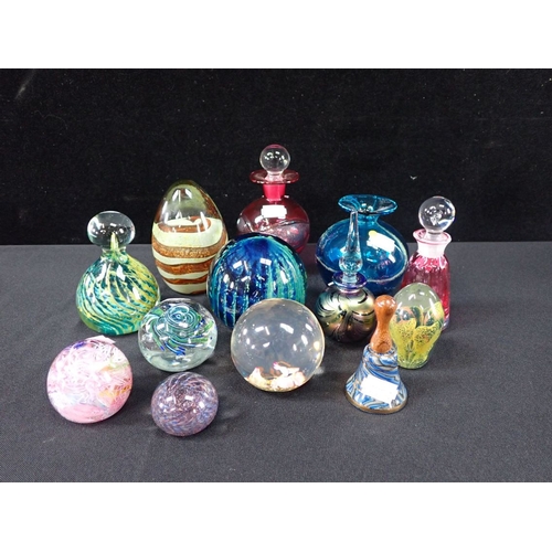 320 - A COLLECTION OF MDINA AND OTHER PAPERWEIGHTS and scent bottles, and a bell (13)