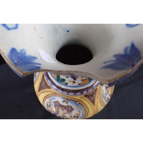 358 - AN ITALIAN MAIOLICA VASE painted with traditional scenes inset into an ochre ground (large chip on r... 