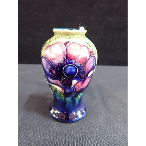 364 - MOORCROFT: AN ANEMONE DECORATED SMALL BALUSTER VASE with paper label; 'Potter to H.M. The Queen' 9.5... 