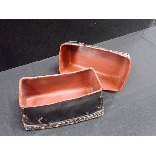 391 - AN ASIAN LACQUER BOX or headrest 24 x 12 x 12cm