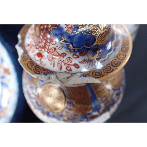 419 - AN IMARI DISH SET IN A CIRCULAR FRAME 