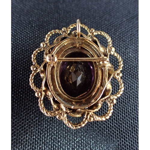 491 - AN AMETHYST AND SEED PEARL 9CT GOLD BROOCH