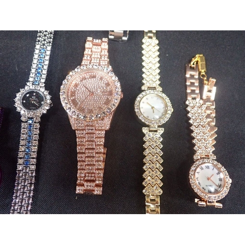 493 - SIX LADIES' WRISTWATCHES four of them profusely 'jewelled'