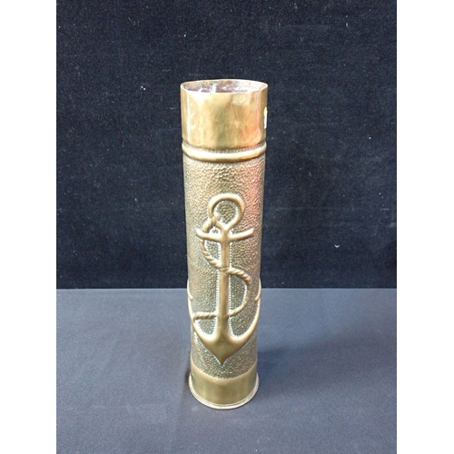 597 - A TRENCH ART BRASS SHELL VASE embossed with an anchor, a bird, and the initials 'H.V' 35cm high