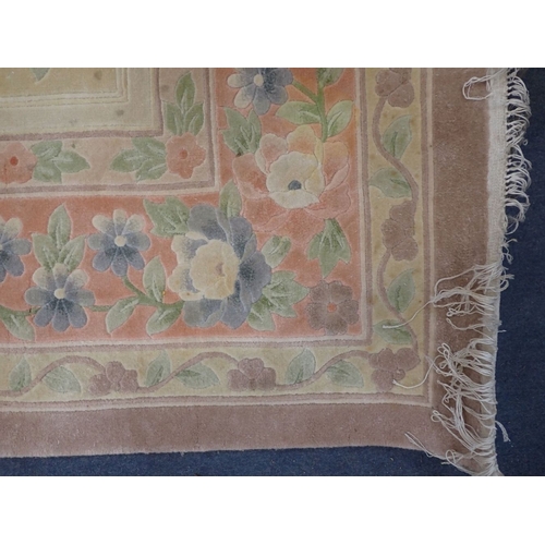 797 - A LARGE CHINESE RUG, SCULPTED PILE pink and cream with floral decoration 280 x 186cm (some marks)