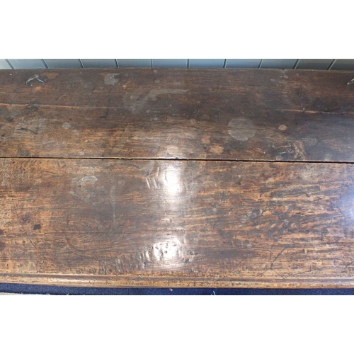 814 - A 17TH CENTURY OAK COFFER with floral frieze and three-panel front, 127cm wide