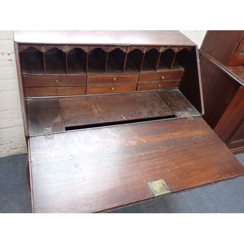 828 - A GEORGE II COUNTRY OAK BUREAU, REPUTEDLY USED BY NAPOLEON 