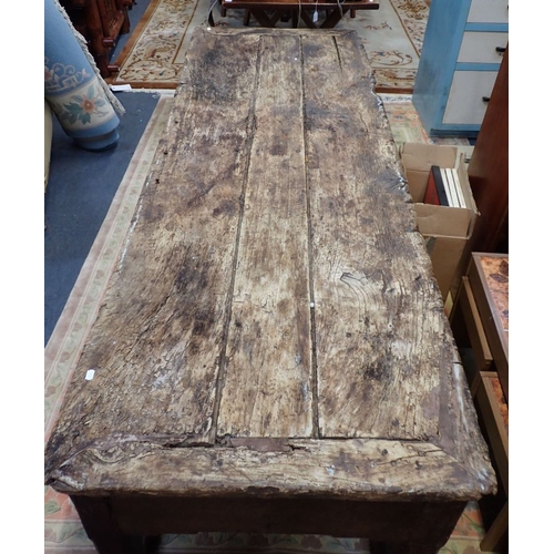 871 - A LARGE 19TH CENTURY RUSTIC FARMHOUSE KITCHEN TABLE the worn and scarred top with cleated ends on ch... 