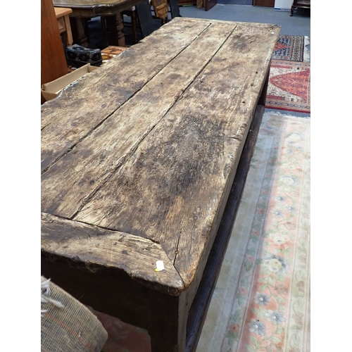 871 - A LARGE 19TH CENTURY RUSTIC FARMHOUSE KITCHEN TABLE the worn and scarred top with cleated ends on ch... 