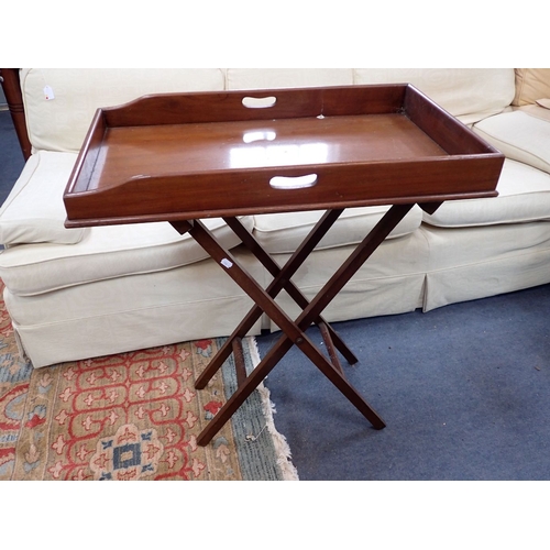 874 - AN EDWARDIAN MAHOGANY BUTLER'S TRAY on folding 'X' stand 76 x 46cm