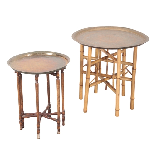 877 - TWO SIMILAR OCCASIONAL TABLES both 20th century, both comprising eastern engraved brass dishes mount... 