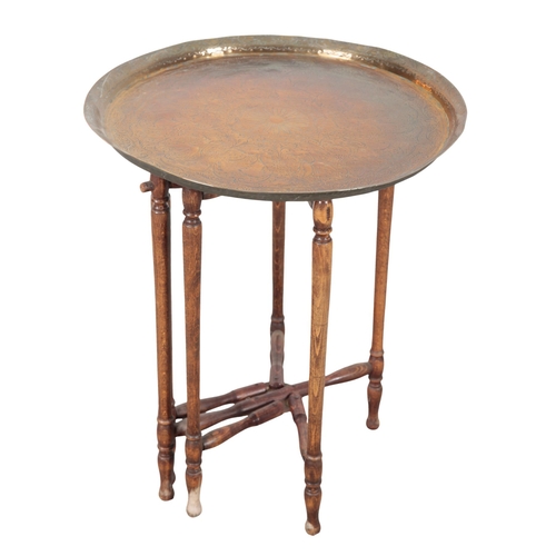 877 - TWO SIMILAR OCCASIONAL TABLES both 20th century, both comprising eastern engraved brass dishes mount... 