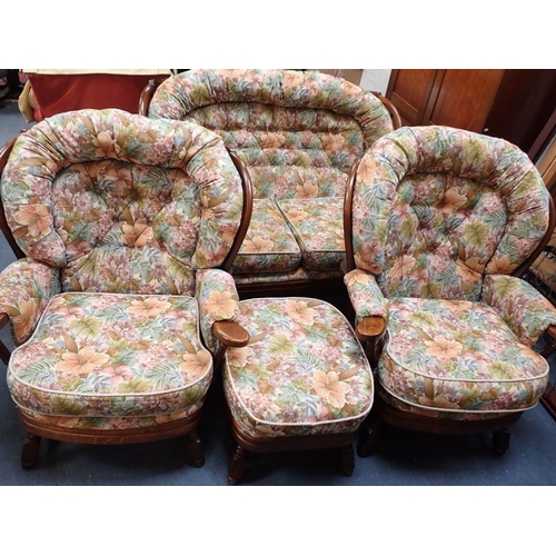 879 - A JOYNSON HOLLAND COTTAGE STYLE SUITE two-seater sofa, two chairs and a footstool (4)