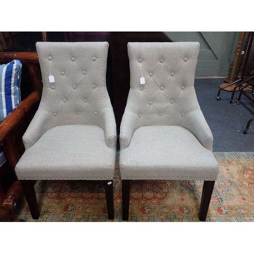 882 - A PAIR OF CONTEMPORARY UPHOLSTERED CHAIRS with buttoned backs and metal ring handles to the rear