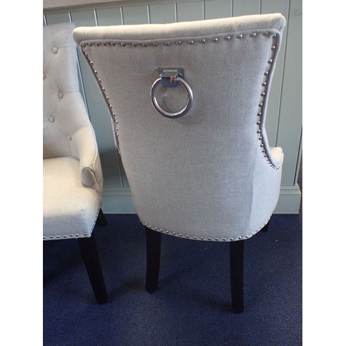 882 - A PAIR OF CONTEMPORARY UPHOLSTERED CHAIRS with buttoned backs and metal ring handles to the rear