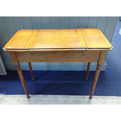 892 - A LATE 19TH CENTURY GOLDEN OAK PATENT DESK (name obscured), with lift-up top revealing fitted interi... 