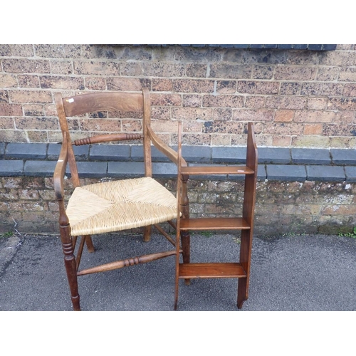 901 - A 19TH CENTURY RUSH-SEATED ARMCHAIR and a narrow mahogany hanging set of shelves 30cm wide (2)