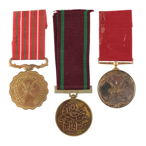 211 - OMAN. THREE MEDALS Oman. Royal Guard of Oman Special Service Medal;
Oman. Glorious Fifteenth Nationa... 