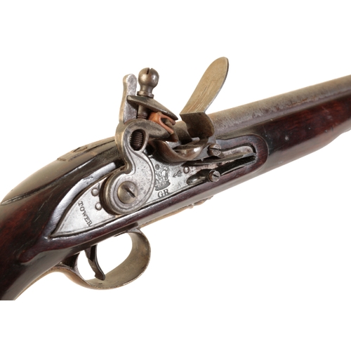 358 - A TOWER FLINTLOCK SERVICE PISTOL with full walnut stock, brass trigger guard and butt plate and bras... 