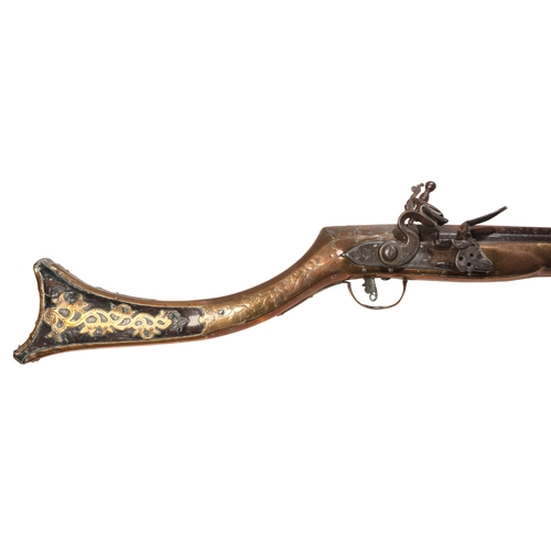 379 - A FLINTLOCK MUSKET with a full walnut stock, brass-bound floral decoration and steel ramrod, stamped... 