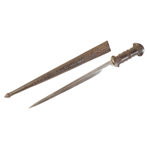 429 - A CAUCASIAN DAGGER circa 1900, with a plain double-edge blade and embossed metal grip, in the origin... 