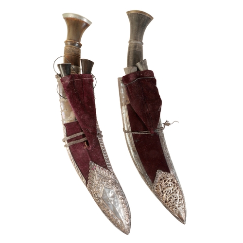 438 - A GURKHA KUKRI KNIFE with an iron-mounted horn hilt, in a white metal floral decorated sheath, inscr... 