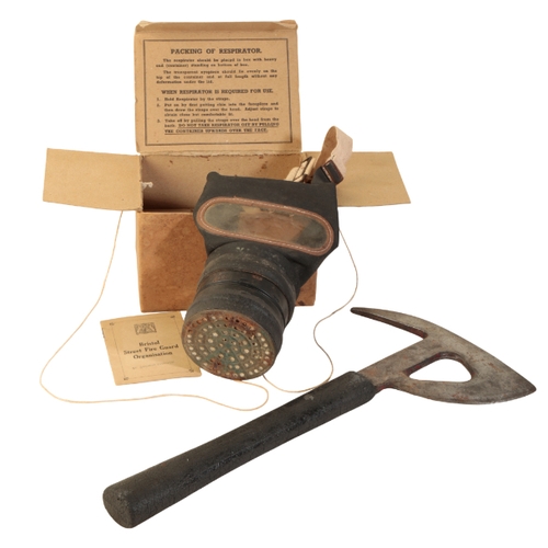 469 - A WWII AIRCRAFT AXE stamped C27N/1 A.N., 29cm long; a WWII gas mask, in the original cardboard box; ... 