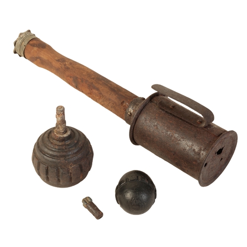 471 - TWO WWI GERMAN EGG BOMBS and a WWI stick grenade, stamped to the wooden grip 