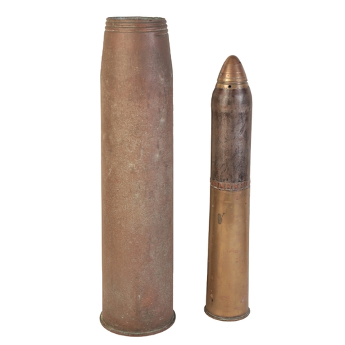 474 - A 1962 BRASS MILITARY SHELL stamped to the base with military crows foot ECC 5, 64cm long; and one o... 