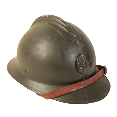 488 - A FRENCH ADRIAN HELMET WITH 'RF' BADGE in green olive paint with 'RF' badge. The helmet post WWI, li... 