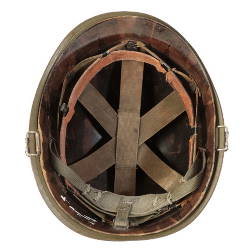 491 - A WWII AMERICAN M1 HELMET with original liner and canvas chin-strap.