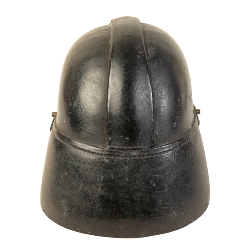 492 - A WWI BRITISH LEATHER FIRE HELMET with original leather lining and leather chin strap, size 6 7/8, w... 