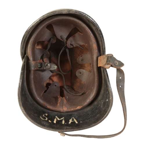 492 - A WWI BRITISH LEATHER FIRE HELMET with original leather lining and leather chin strap, size 6 7/8, w... 