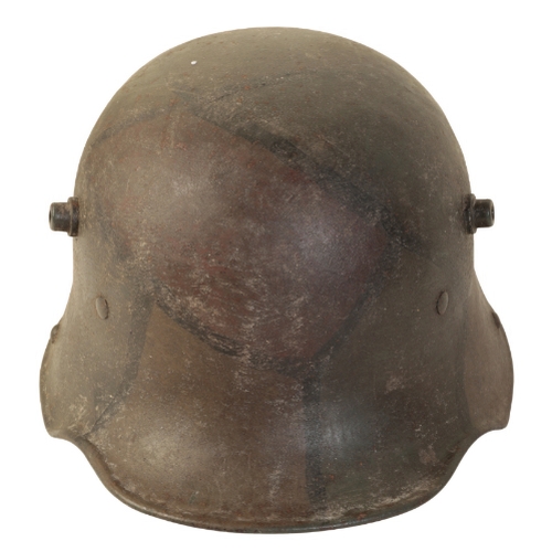 494 - A WWI GERMAN CAMOUFLAGE HELMET with the original leather lining, stamped to the interior 