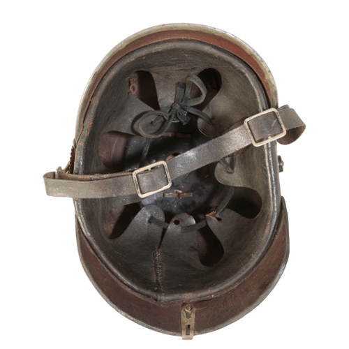 497 - A WWI IMPERIAL GERMAN PICKELHAUBE the leather skull with original lining and leather chin strap,  sp... 