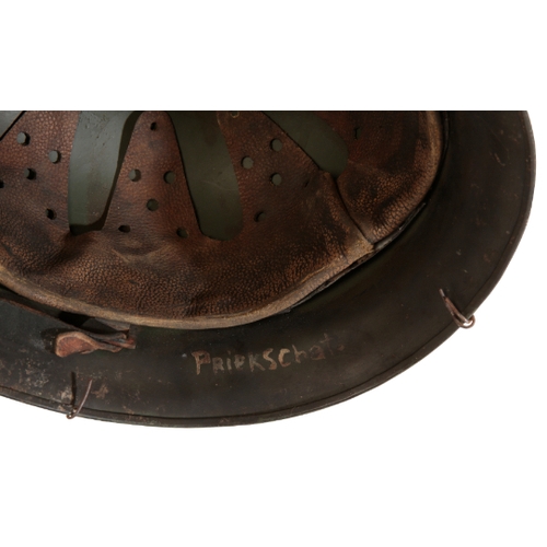 509 - A WWII GERMAN HELMET with a single decal, M43 field brown camouflage with metal-covered netting and ... 