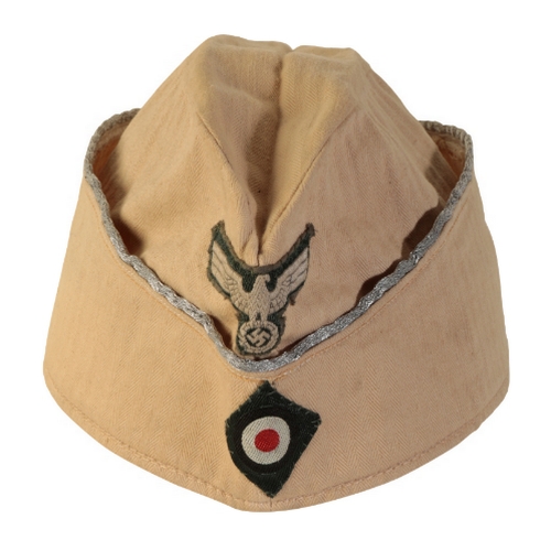 519 - A WWII GERMAN OFFICERS SIDE CAP with army eagle insignia, silver bullion piping, leather sweat band ... 