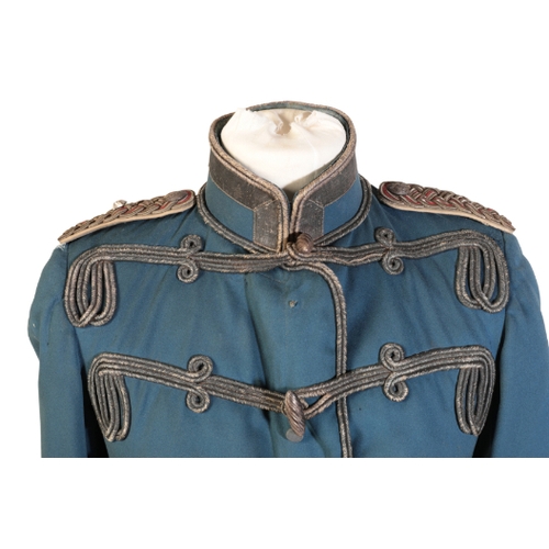 523 - A 19TH CENTURY IMPERIAL GERMAN/PRUSSIAN ARMY OFFICER'S JACKET with epaulettes and blue silk lining.