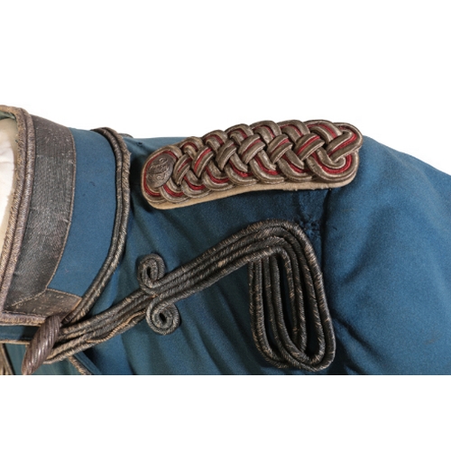 523 - A 19TH CENTURY IMPERIAL GERMAN/PRUSSIAN ARMY OFFICER'S JACKET with epaulettes and blue silk lining.