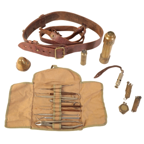 595 - THREE WWI TRENCH LIGHTS a Sam Brown WWI bullet removal kit; a brass telescope; a shell fuse cap and ... 