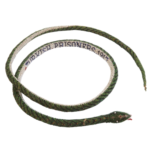 602 - A TURKISH PRISONER OF WAR BEADED SNAKE dated 1917, 134cm long