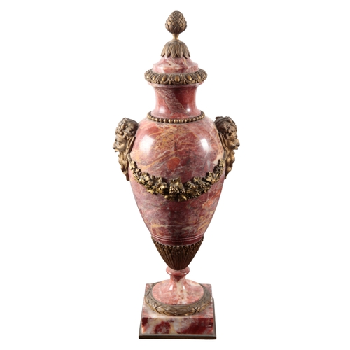 108 - A PAIR OF NEOCLASSICAL MARBLE AND GILT METAL MOUNTED URNS 20th century, of baluster form, with acorn... 