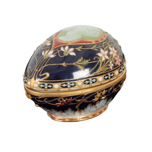 133 - A LATE 19TH CENTURY KPM PORCELAIN EGG SHAPED TRINKET BOX of Art Nouveau style, the lid with pate sur... 