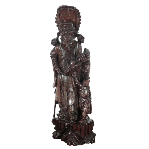 150 - A CHINESE CARVED WOOD LAMP BASE 20th century, in the form of a figural group, the electrical fitment... 