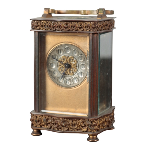 152 - A BRASS CARRIAGE CLOCK with silvered chapter tings and Arabic numerals, with c-scroll embossed friez... 