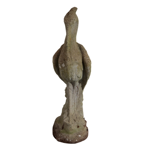 16 - A RECONSTITUTED STONE HERON figured naturistically on a rocky base, 85cm high