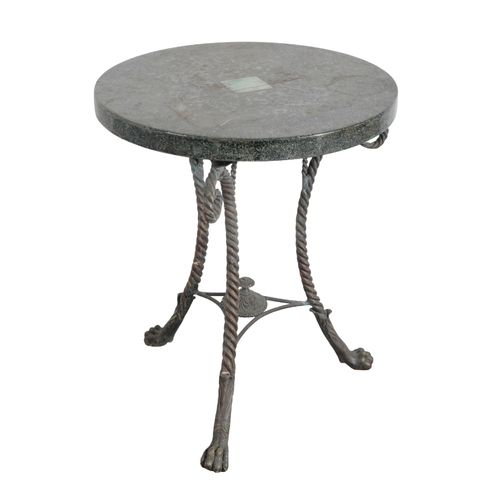 2 - AN EMPIRE STYLE TRIPOD TABLE the circular top on three scrolled and wrythen turned sabre legs, termi... 